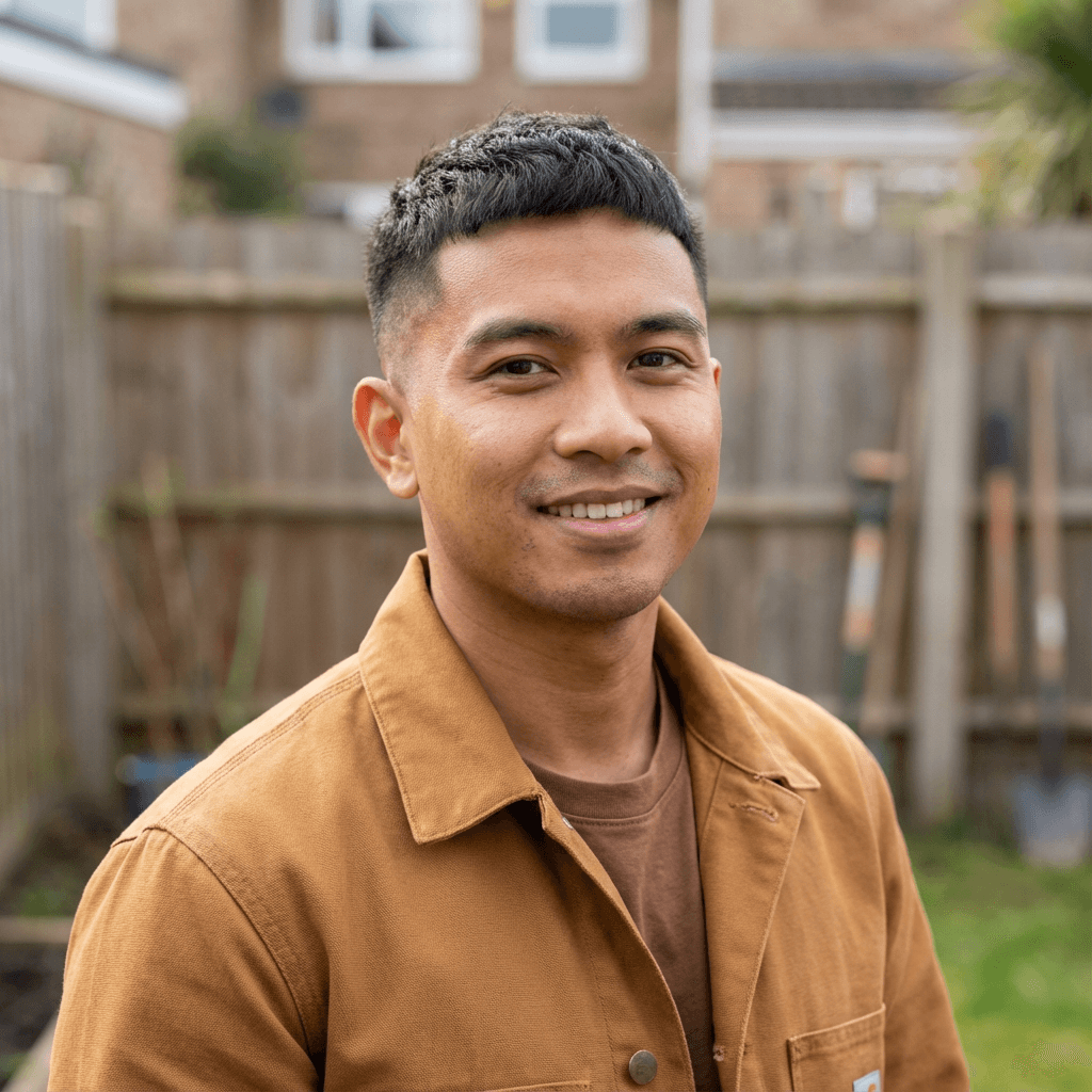 male South Asian professional in his 30s in a professional setting
